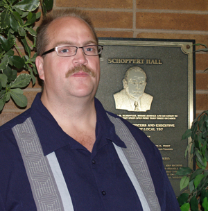 <b>Bruce Hansen</b>, newly elected president of ATU Local 757, stands by the plaque <b>...</b> - BruceHansen